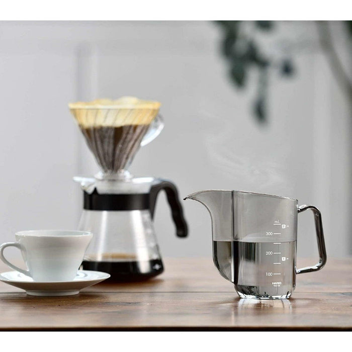 Hario air kettle being poured into v60 pourover