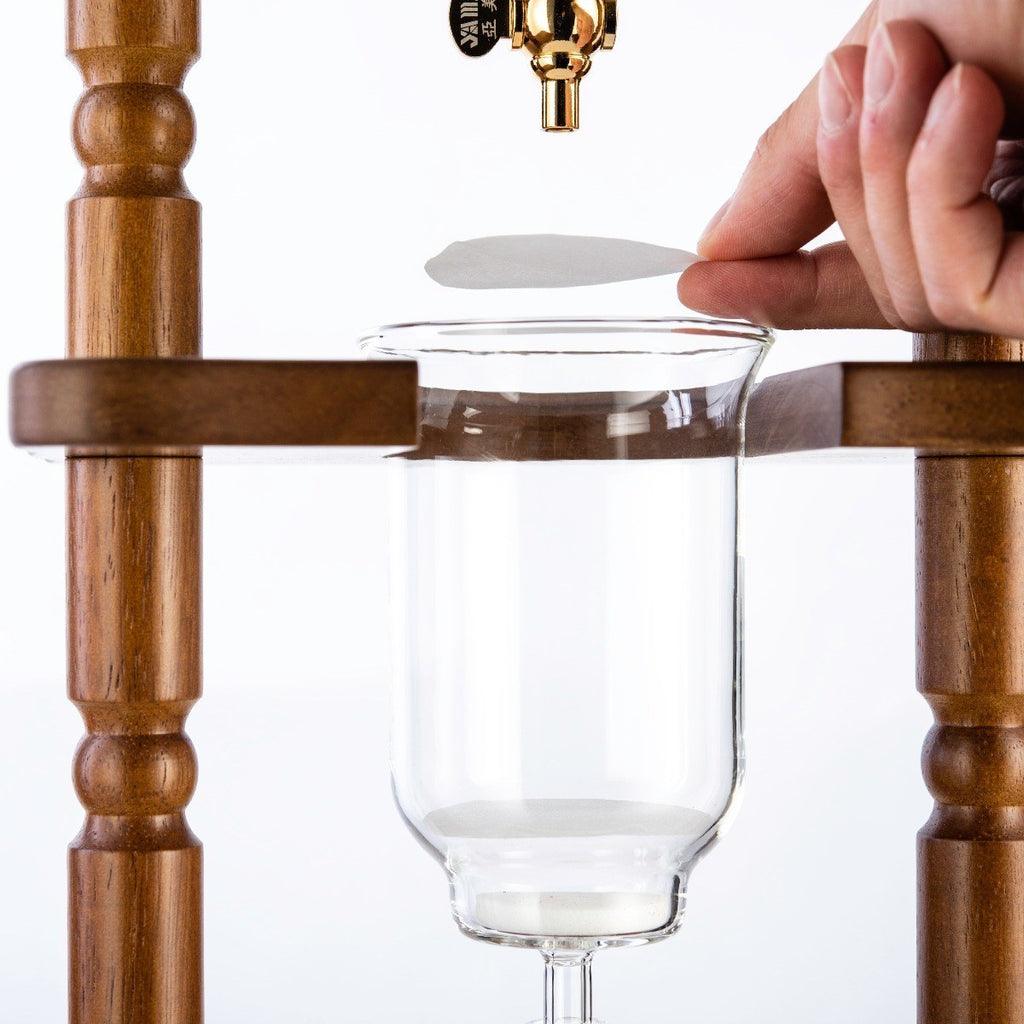 https://luxio.com/cdn/shop/files/yama-6-8-cup-cold-drip-maker-curved-brown-wood-frame-32oz-luxio-5.jpg?v=1690866762